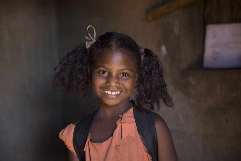 Rosia from Madagaskar no longer works in the mica mines. She enjoys going to school everyday.