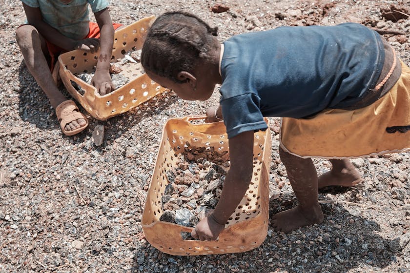 Children at work in a mica mine.